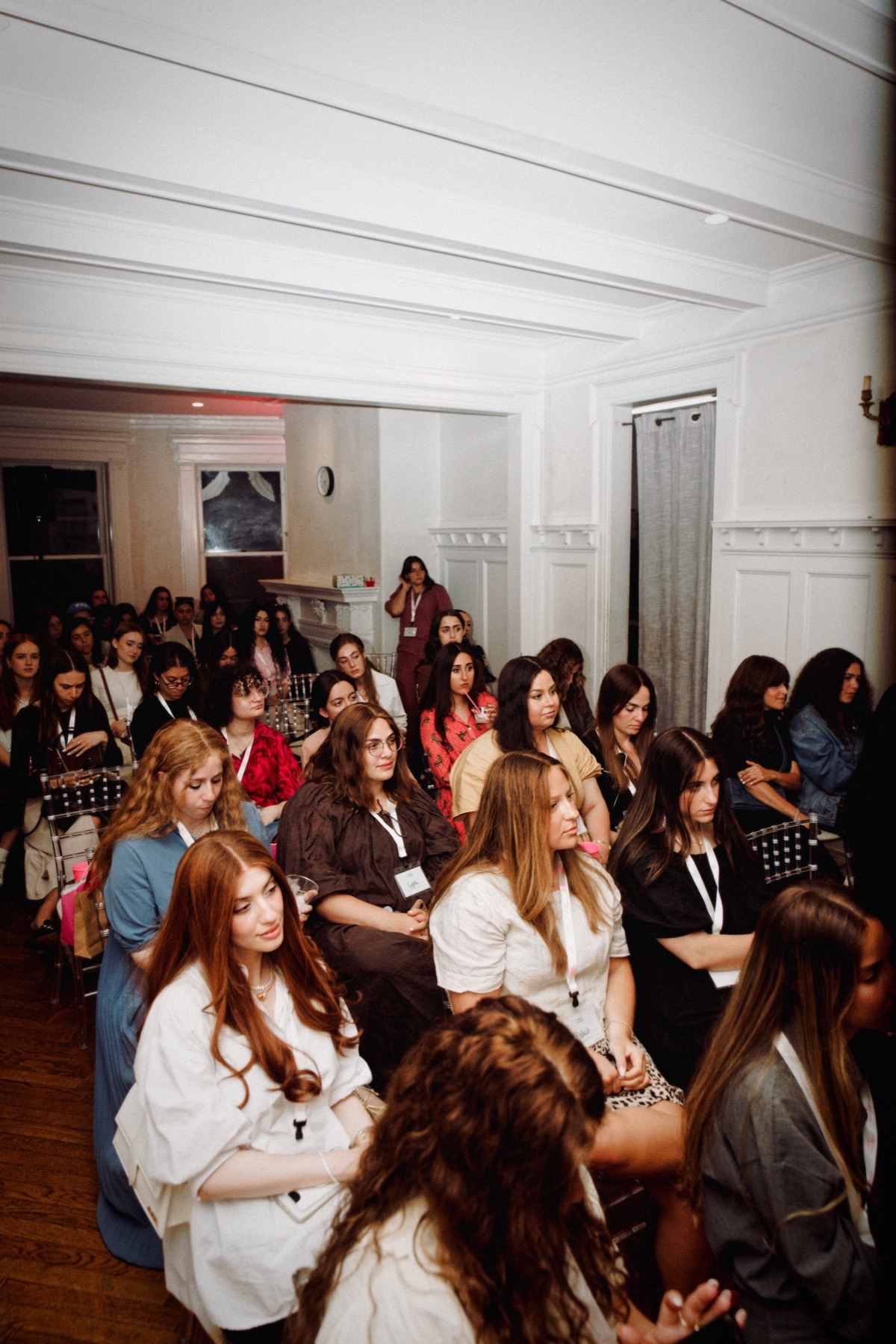 Guests listening to the panel