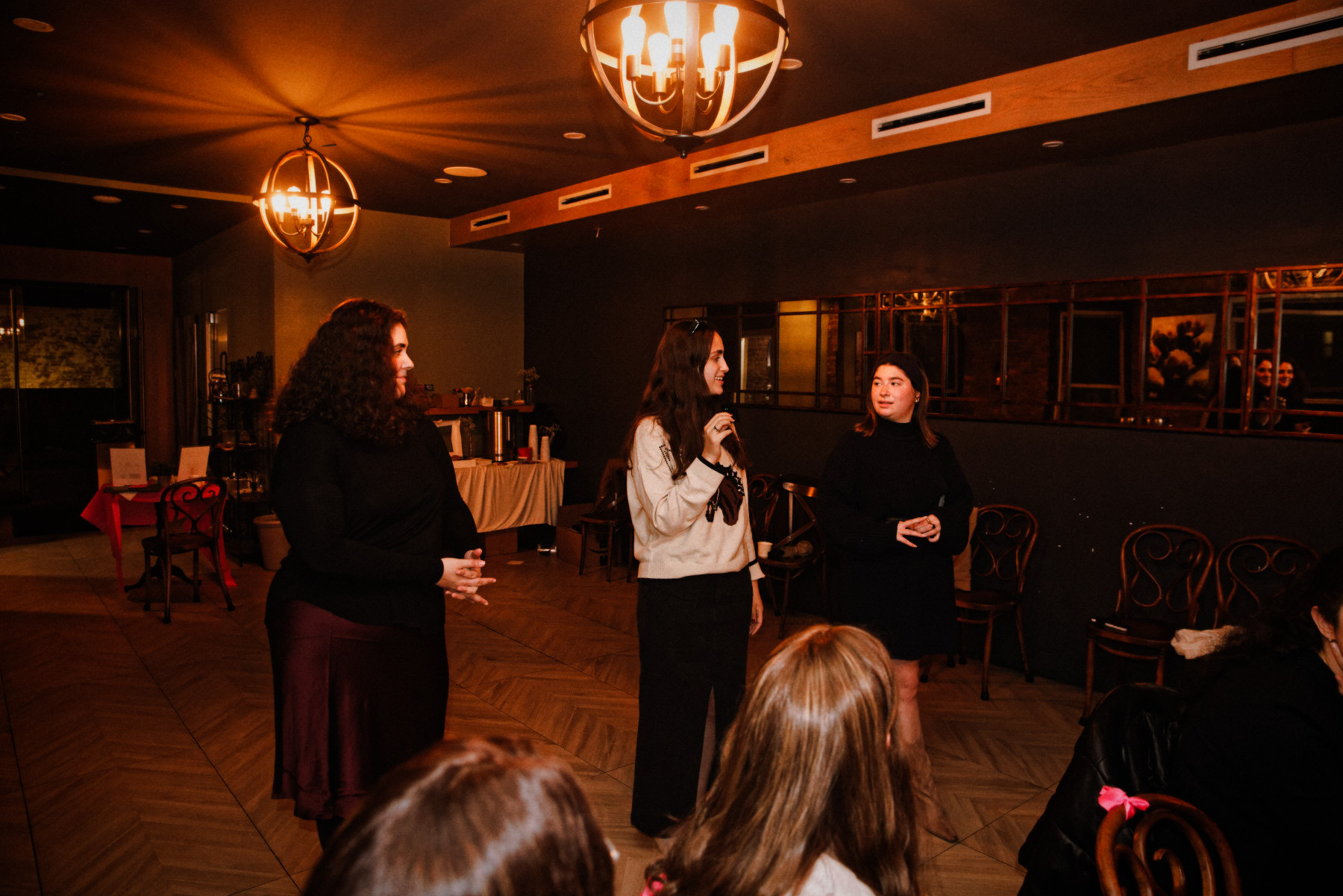 The hosts welcoming the room