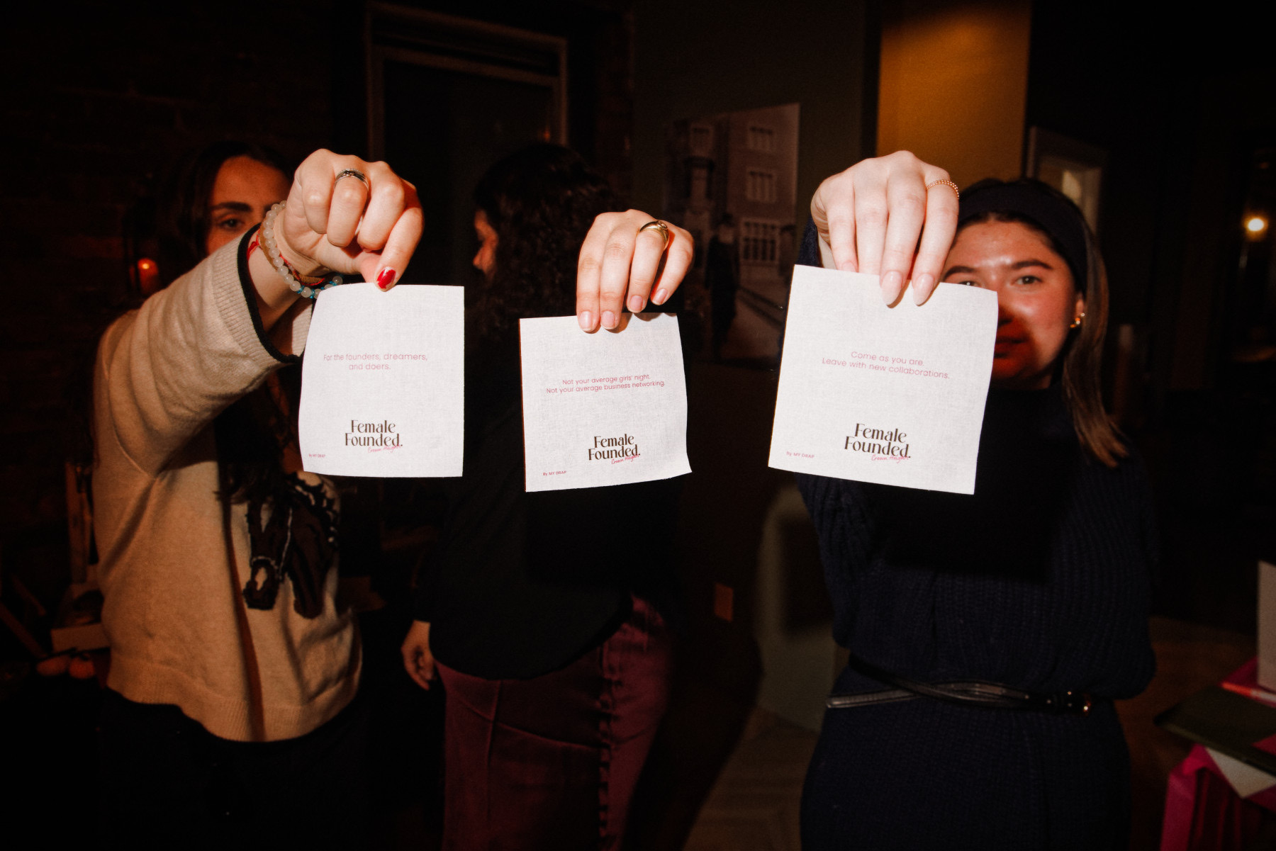 Guests holding their intention cards