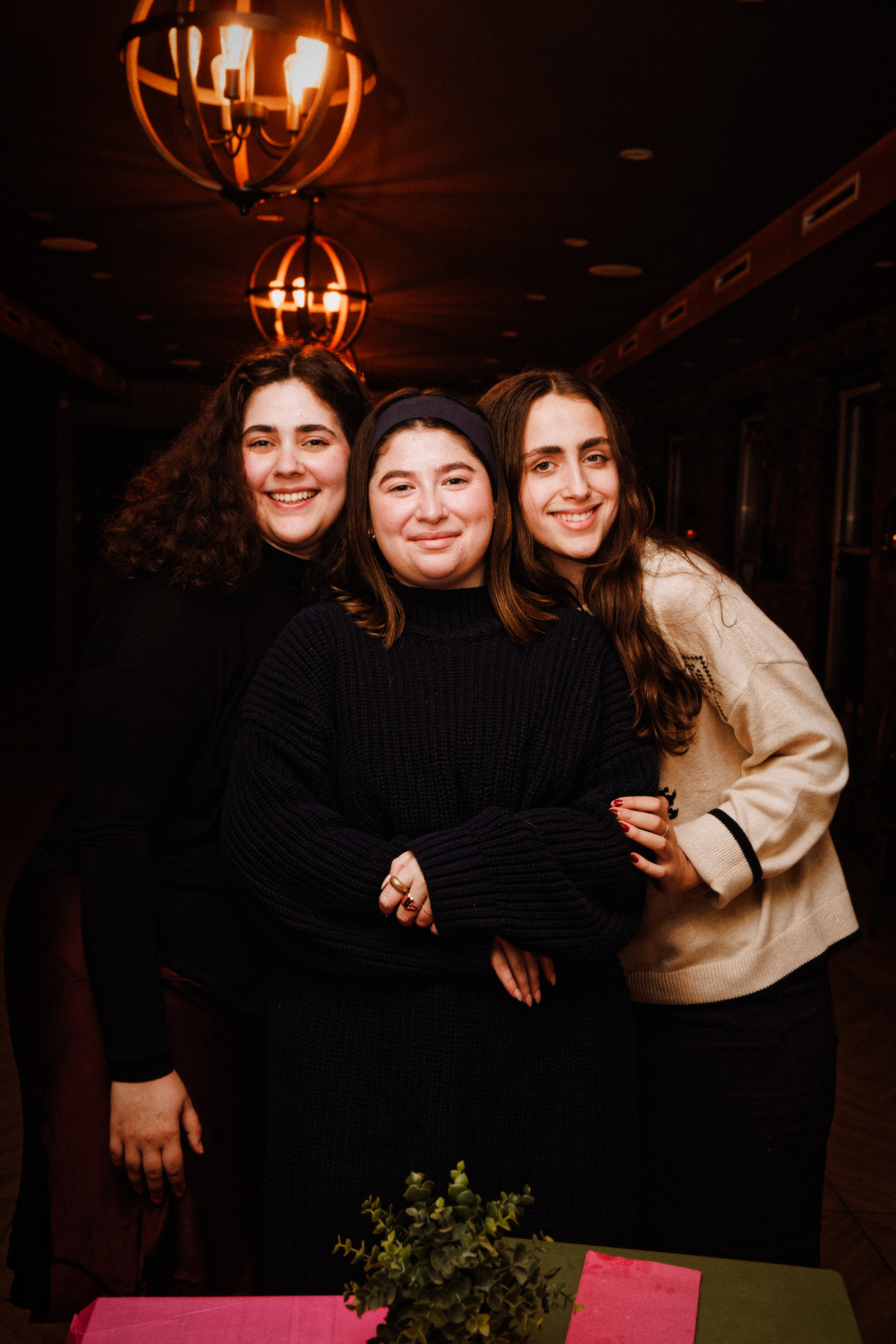 Three friends posing together